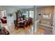 Elegant dining room featuring hardwood floors, a decorative hutch, and a stylish chandelier at 1995 E 166Th Ave, Thornton, CO 80602