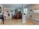 Elegant dining room featuring hardwood floors, a decorative hutch, and a stylish chandelier at 1995 E 166Th Ave, Thornton, CO 80602