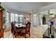 Elegant dining room featuring hardwood floors, a decorative hutch, and a stylish chandelier at 1995 E 166Th Ave, Thornton, CO 80602