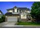 Charming two-story home with brick accents, well-manicured lawn, and an attached two-car garage at 1995 E 166Th Ave, Thornton, CO 80602