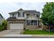 Charming two-story home with brick accents, well-manicured lawn, and an attached two-car garage at 1995 E 166Th Ave, Thornton, CO 80602