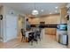 Spacious eat-in kitchen features stainless steel appliances and light wood cabinetry at 1995 E 166Th Ave, Thornton, CO 80602