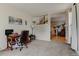 Inviting living room with desk, carpeted floors and bright, airy windows at 1995 E 166Th Ave, Thornton, CO 80602