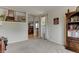 Bright living room with carpeted floors, large window and decorative shelving at 1995 E 166Th Ave, Thornton, CO 80602