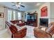 Spacious living room with fireplace, hardwood flooring and comfortable leather seating at 1995 E 166Th Ave, Thornton, CO 80602