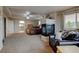 Spacious primary bedroom features tray ceilings, fireplace, sitting area, and an en-suite bathroom at 1995 E 166Th Ave, Thornton, CO 80602