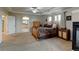 Spacious primary bedroom features tray ceilings, fireplace, sitting area, and an en-suite bathroom at 1995 E 166Th Ave, Thornton, CO 80602