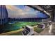 Interior view of Topgolf with hitting bays, golf course view, and advanced gaming technology at 1995 E 166Th Ave, Thornton, CO 80602
