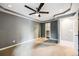 Spacious bedroom featuring carpeted floor, neutral paint, closet, and modern ceiling fan at 14852 E Kentucky Dr # 928, Aurora, CO 80012