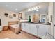 Bathroom features double sinks, ample cabinetry, and a soaking tub at 720 Reid Pl, Castle Rock, CO 80108