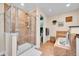 Bathroom featuring a glass enclosed shower, a soaking tub, and vanity at 720 Reid Pl, Castle Rock, CO 80108