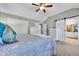Bedroom with vaulted ceiling, barn door to Primary bath, and generous closet space at 720 Reid Pl, Castle Rock, CO 80108