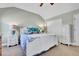 Well-lit bedroom featuring a decorative white bed frame, side tables, and spacious closet at 720 Reid Pl, Castle Rock, CO 80108