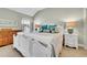 Bright bedroom with a decorative white bed frame and ample natural light from the window at 720 Reid Pl, Castle Rock, CO 80108