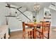Charming dining area featuring a round table, staircase access, and easy access to the living area at 720 Reid Pl, Castle Rock, CO 80108