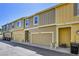 View of the townhome's exterior, featuring an attached two-car garage at 720 Reid Pl, Castle Rock, CO 80108
