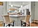 Kitchen features an island with seating, stainless steel appliances, and granite countertops at 720 Reid Pl, Castle Rock, CO 80108