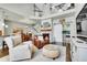 Open-concept living space with a fireplace, hardwood floors, and a view of the staircase at 720 Reid Pl, Castle Rock, CO 80108