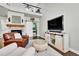 Inviting living room features a stone fireplace, a barn door, and a loft area above at 720 Reid Pl, Castle Rock, CO 80108