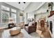 Bright living room with hardwood floors, neutral furniture, and an open floor plan into the dining area and kitchen at 720 Reid Pl, Castle Rock, CO 80108