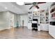 Another view of the office featuring custom built-ins, a ceiling fan and hardwood flooring at 720 Reid Pl, Castle Rock, CO 80108