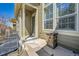 Charming front porch area featuring stylish outdoor seating and a decorative stone fire pit at 720 Reid Pl, Castle Rock, CO 80108