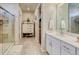 Hall Bathroom with a tiled shower and white vanity at 9227 Salida St, Commerce City, CO 80022