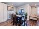 Elegant dining area featuring a spacious table, creating a warm and inviting atmosphere for Gathering gatherings at 9227 Salida St, Commerce City, CO 80022