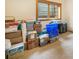 Unfinished basement filled with boxes and storage containers at 18750 Spring Valley Rd, Monument, CO 80132