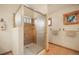 Bathroom showcasing a glass-enclosed shower and tiled walls at 18750 Spring Valley Rd, Monument, CO 80132