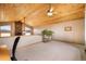 Spacious bonus room featuring vaulted wood ceilings, carpeted floors and large picture windows at 18750 Spring Valley Rd, Monument, CO 80132