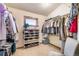 Walk-in closet with custom shelving for clothing and shoes at 18750 Spring Valley Rd, Monument, CO 80132