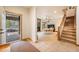 Inviting entryway with tile floors leading to the dining room and featuring a stairway to the upper level at 18750 Spring Valley Rd, Monument, CO 80132