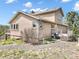 Charming home featuring a deck, and a landscaped yard with rock ground cover at 18750 Spring Valley Rd, Monument, CO 80132