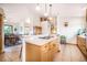 This spacious kitchen is equipped with stainless steel appliances, tile floors and solid countertops at 18750 Spring Valley Rd, Monument, CO 80132