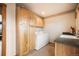 Laundry room featuring cabinets, washer, dryer and countertop at 18750 Spring Valley Rd, Monument, CO 80132