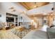 Living room has a vaulted, wood ceiling and an open staircase to the second floor at 18750 Spring Valley Rd, Monument, CO 80132