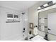 Modern bathroom with sleek fixtures, white subway tile, and a minimalist design at 5505 Brentwood St, Arvada, CO 80002