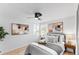 Bright bedroom features stylish decor, a ceiling fan, and plenty of natural light at 5505 Brentwood St, Arvada, CO 80002
