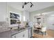 Bright and modern kitchen featuring stainless steel appliances and a view to the dining area at 5505 Brentwood St, Arvada, CO 80002