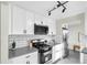 Kitchen featuring stainless steel appliances, ample counter space, and stylish backsplash at 5505 Brentwood St, Arvada, CO 80002