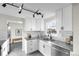 Well-lit kitchen with stainless steel appliances, modern finishes, and ample storage at 5505 Brentwood St, Arvada, CO 80002