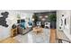 Beautifully decorated living room with plenty of natural light, plants, and unique decor at 5505 Brentwood St, Arvada, CO 80002