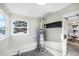 Bright utility room with sleek flooring, window, and water heater at 5505 Brentwood St, Arvada, CO 80002