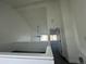 Upstairs hallway with fresh paint and carpeting leading to bedrooms at 11113 E Alameda # 207, Aurora, CO 80012