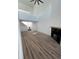 Bright living room with high ceilings, fireplace, and wood-look flooring at 11113 E Alameda # 207, Aurora, CO 80012