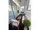 Relaxing sun room with plenty of natural light, comfortable seating, and view of the yard at 11113 E Alameda # 207, Aurora, CO 80012