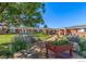Charming red brick building with landscaped front lawn, inviting pathway, and colorful flowerbeds at 5425 County Rd 32 # 27, Mead, CO 80504