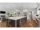 Modern kitchen featuring a large island with stainless steel appliances at 2717 S Langley Ct, Denver, CO 80210