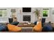Inviting living room featuring a fireplace, TV, comfortable seating, and lots of natural light at 2717 S Langley Ct, Denver, CO 80210